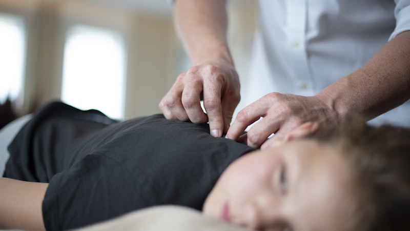A chiropractic adjustment in progress